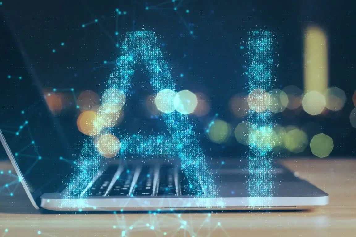A laptop displays insights into AI search visibility.